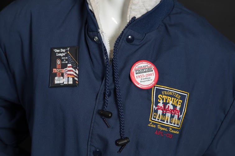 This Frontier Strike jacket is a commemorative piece in remembrance of one of the longest strike in US history. Fastened to the jacket are pins also remembering the journey the Culinary Union members and striker took during their seven year conflict with the New Frontier Casino.  