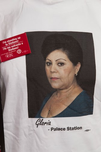 This t-shirt was part of a campaign by the Culinary Union to support Station Casino employees to have the right to unionize. The series of shirts had different pictures of Station Casino employees. Attached to the t-shirt is a button, written in English and Spanish, showing the union's support of giving Station employees the right to choose. 